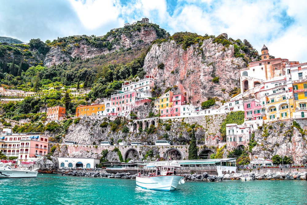 Experience coastal elegance along the breathtaking Amalfi Coast, where dramatic cliffs meet azure waters in an enchanting Italian paradise.